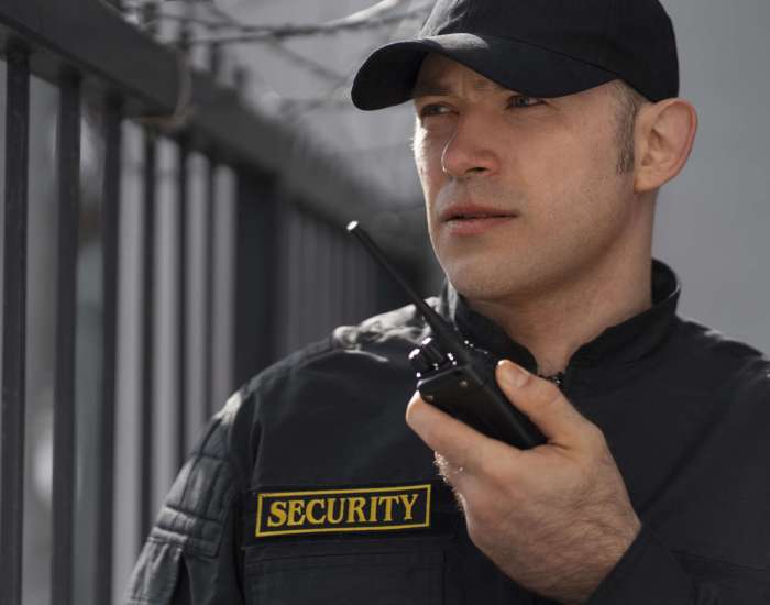 portrait male security guard with radio station